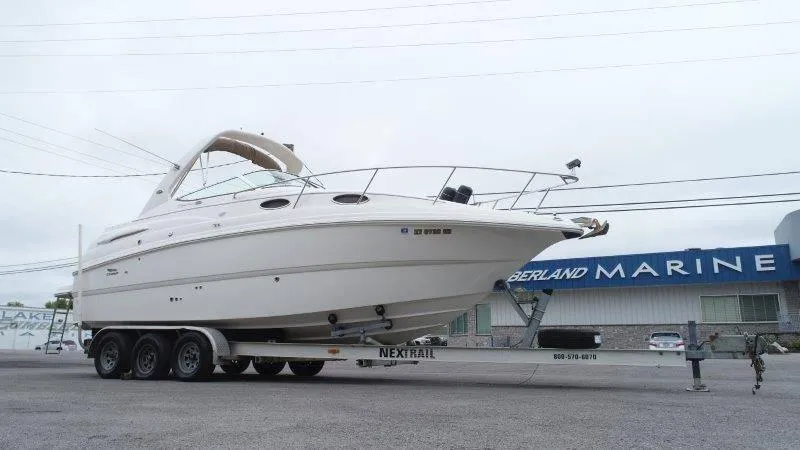Slide: The Image of 2004 Chaparral 260 Signature boat on trailer at a marine dealership. - 12
