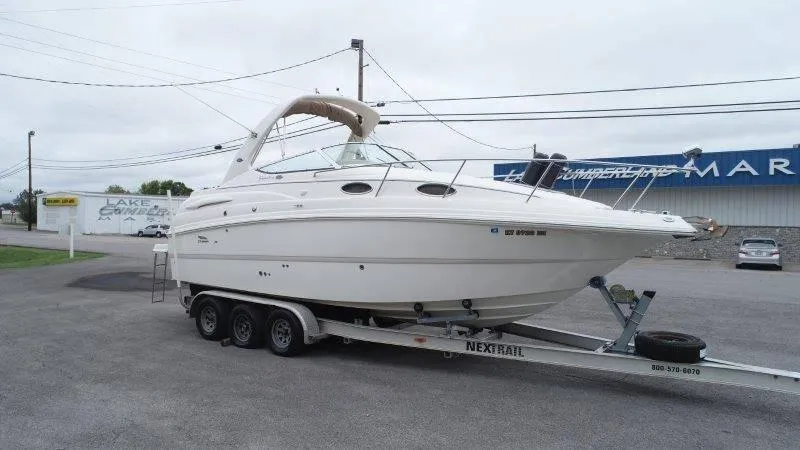 Slide: The Image of 2004 Chaparral 260 Signature boat on trailer in parking lot. - 15