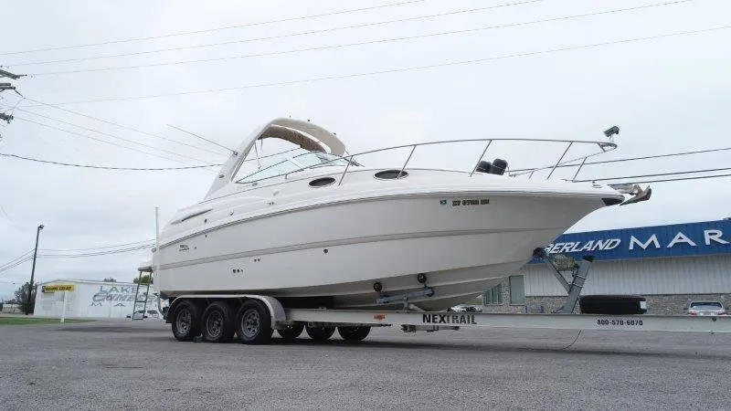 Slide: The Image of 2004 Chaparral 260 Signature boat on trailer at marina. - 16