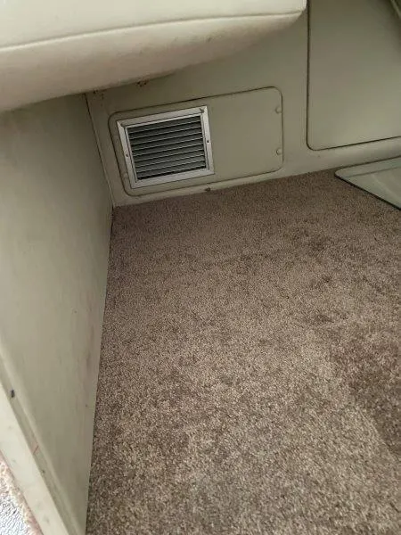 Slide: The Image of 2004 Chaparral 260 Signature interior with carpeted flooring and vent. - 23