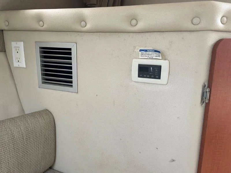 Slide: The Image of Interior of 2004 Chaparral 260 Signature with vent, outlet, and control panel. - 31