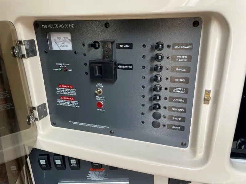 Slide: The Image of Electrical control panel of 2004 Chaparral 260 Signature boat. - 37