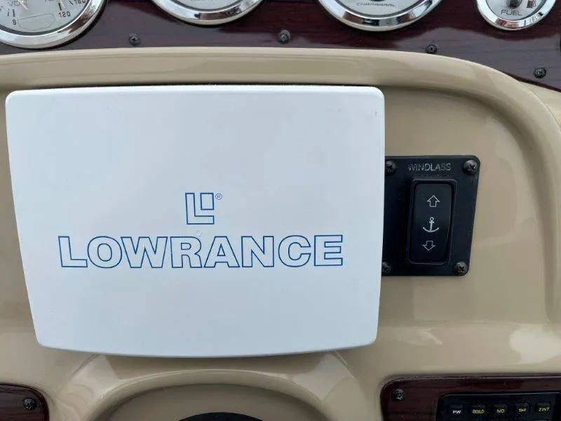 Slide: The Image of Lowrance device on 2004 Chaparral 260 Signature boat dashboard with windlass control. - 38