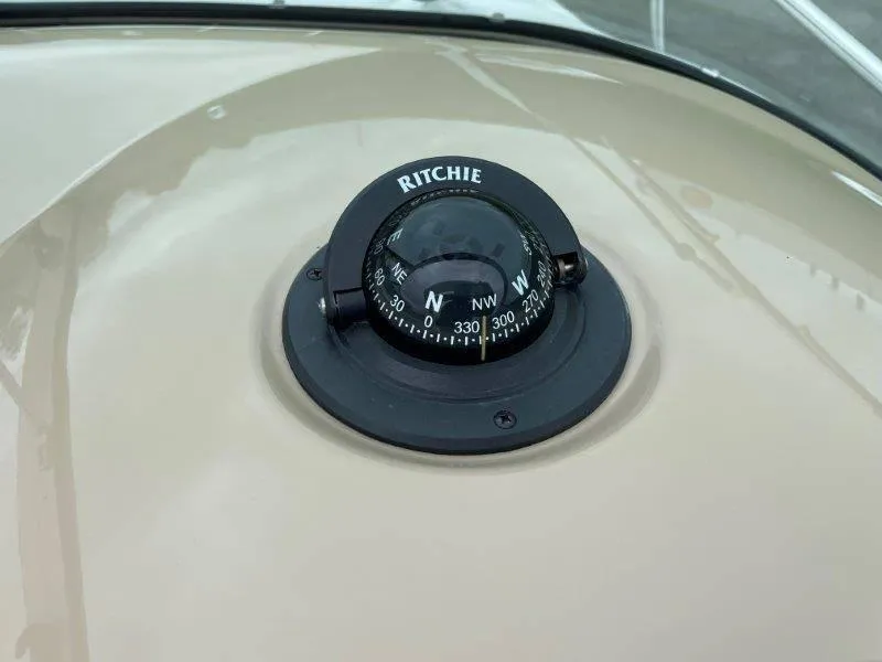 Slide: The Image of Ritchie compass on 2004 Chaparral 260 Signature boat dashboard. - 45