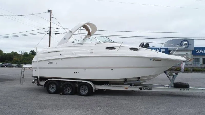 Slide: The Image of 2004 Chaparral 260 Signature boat on trailer in parking lot. - 9