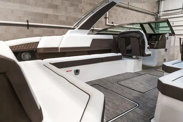 Slide: The Image of 2025 Cobalt R33 boat interior with modern seating and sleek design. - 12