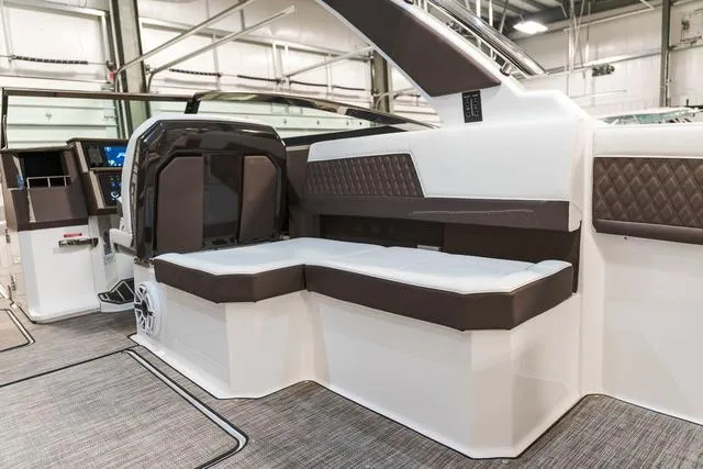 Slide: The Image of 2025 Cobalt R33 boat interior with sleek seating and modern design. - 13