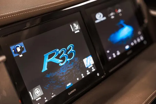 Slide: The Image of Dual touchscreen displays in 2025 Cobalt R33 vehicle dashboard, featuring Garmin interface. - 21