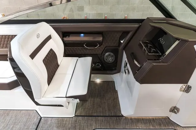 Slide: The Image of 2025 Cobalt R33 interior with white and brown seating, modern dashboard, and sleek design. - 24