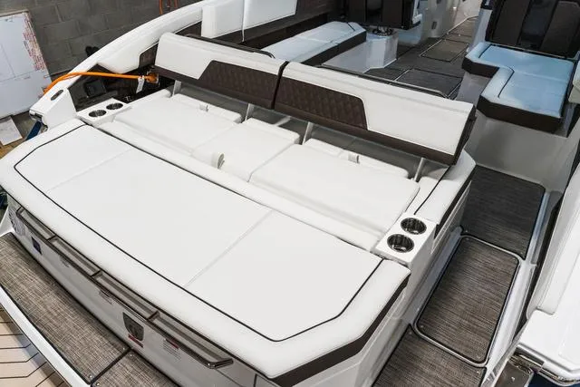 Slide: The Image of 2025 Cobalt R33 boat interior with white seating and cup holders. - 3