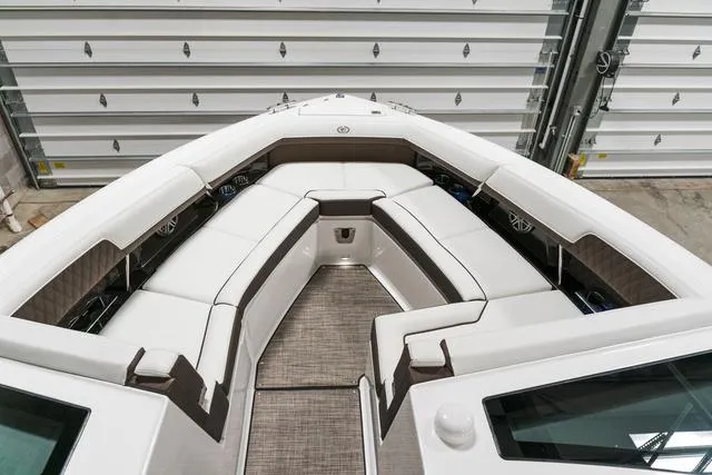 Slide: The Image of 2025 Cobalt R33 boat interior with white seating and modern design. - 31