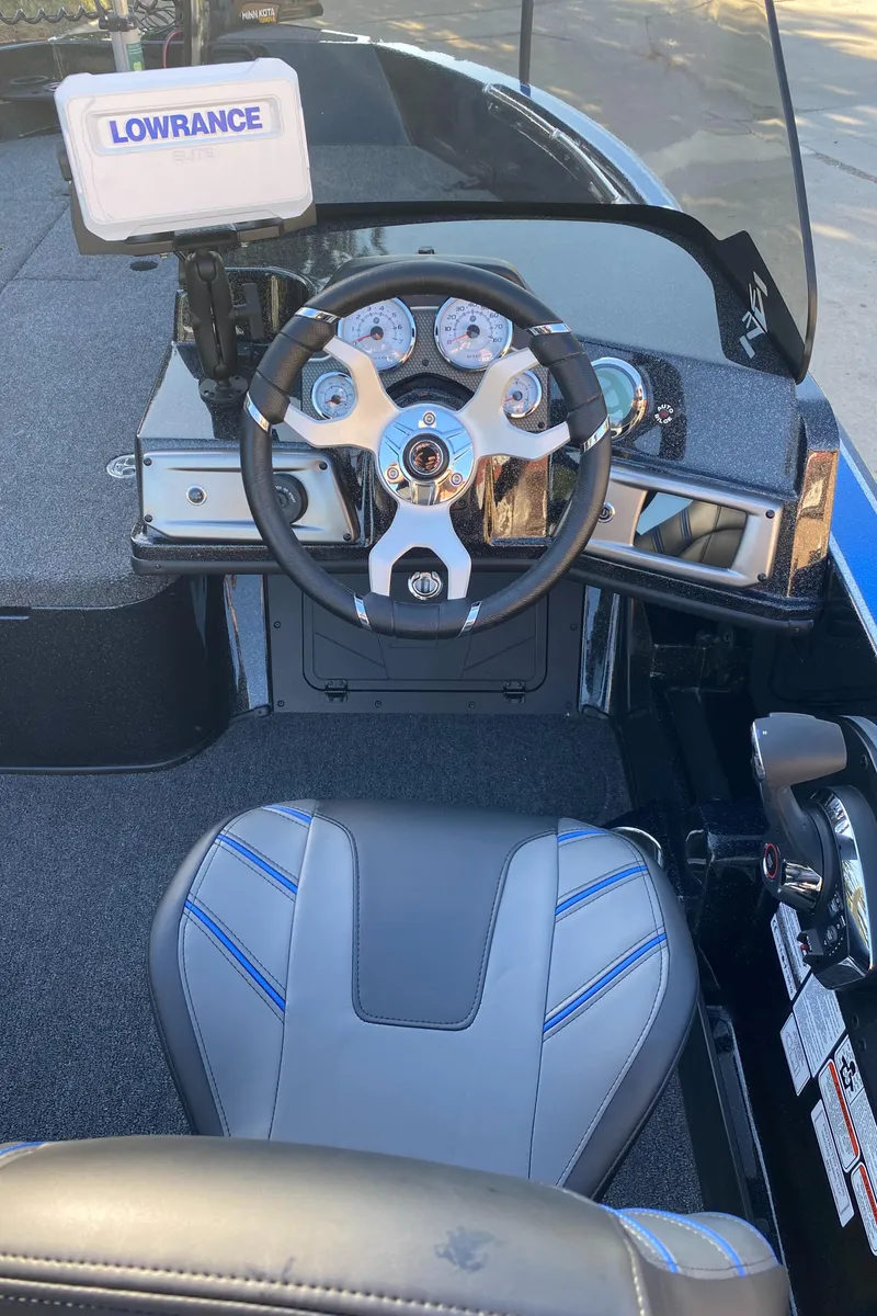Slide: The Image of 2024 Nitro ZV20 boat cockpit with steering wheel and Lowrance navigation system. - 6