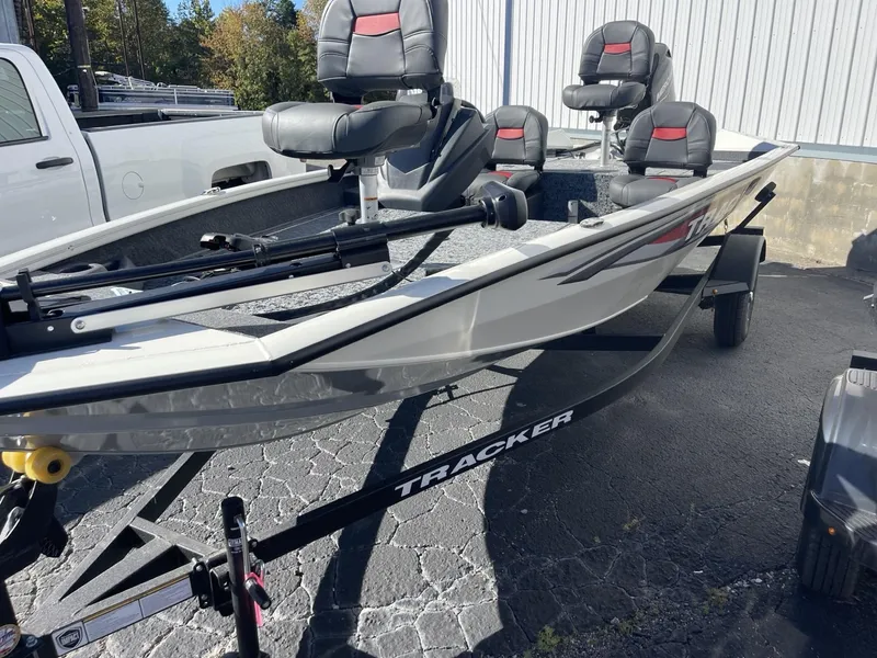 Slide: The Image of 2025 Tracker Pro Team 175 Crappie Edition boat on trailer, parked outdoors. - 3