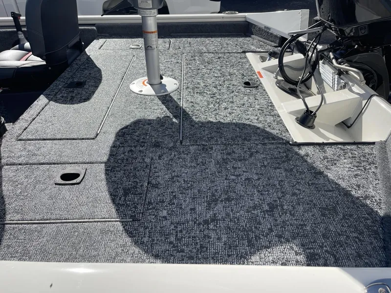 Slide: The Image of 2025 Tracker Pro Team 175 Crappie Edition boat deck with fishing seat and motor. - 5