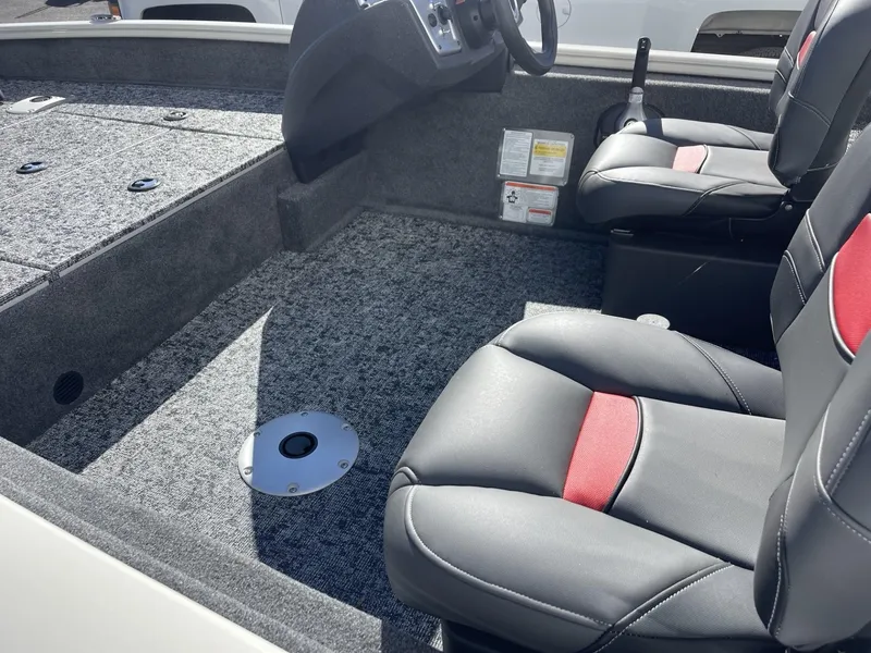 Slide: The Image of 2025 Tracker Pro Team 175 Crappie Edition boat interior with gray and red seating. - 6