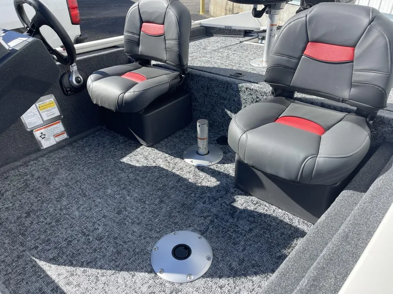Slide: The Image of 2025 Tracker Pro Team 175 Crappie Edition boat interior with two cushioned seats. - 7