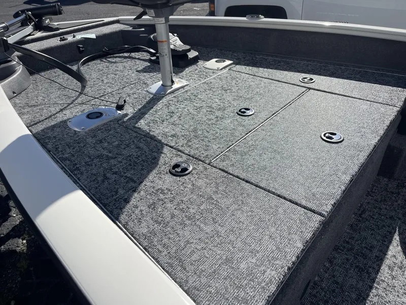 Slide: The Image of 2025 Tracker Pro Team 175 Crappie Edition boat deck with storage compartments. - 8
