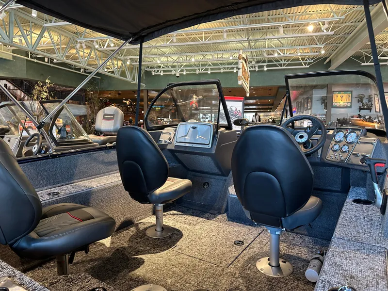 Slide: The Image of 2025 Tracker Pro Guide V-175 WT boat interior with seating and dashboard. - 4