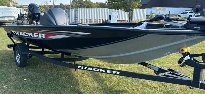 Slide: The Image of 2025 Tracker Pro Team 175 Crappie Edition boat on trailer, parked on grass. - 4