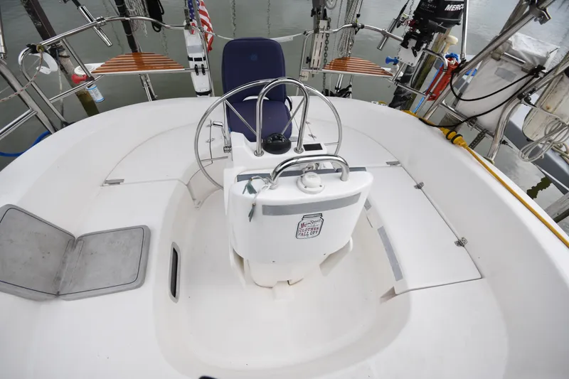 Slide: The Image of Cockpit of 2003 Hunter 386 sailboat with steering wheel and seating. - 20