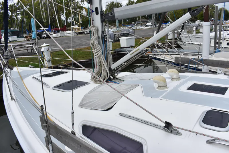 Slide: The Image of 2003 Hunter 386 sailboat docked at marina, showing deck and rigging details. - 10