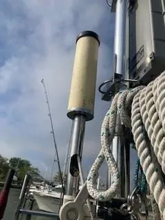Slide: The Image of Close-up of a 2003 Hunter 386 sailboat rigging with ropes and mast against a cloudy sky. - 18