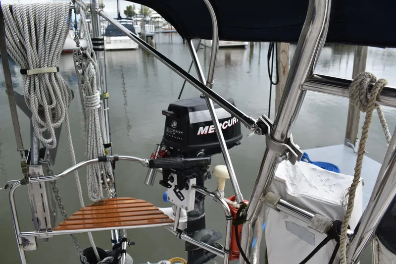 Slide: The Image of 2003 Hunter 386 sailboat with Mercury outboard motor at marina. - 17