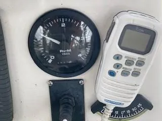 Slide: The Image of Close-up of a 2003 Hunter 386 boat's RPM gauge and marine radio. - 24