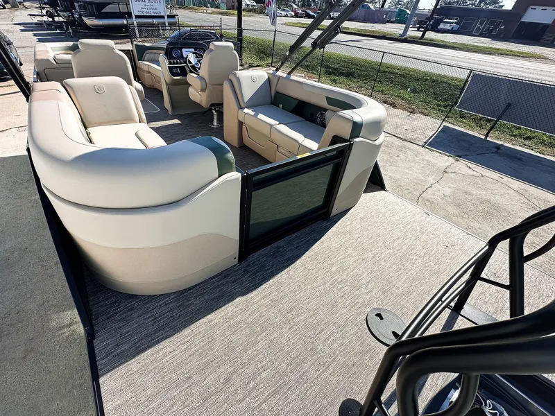 Slide: The Image of 2025 Godfrey Sweetwater Tritoon with split bench seating, showcasing spacious and luxurious interior design. - 16