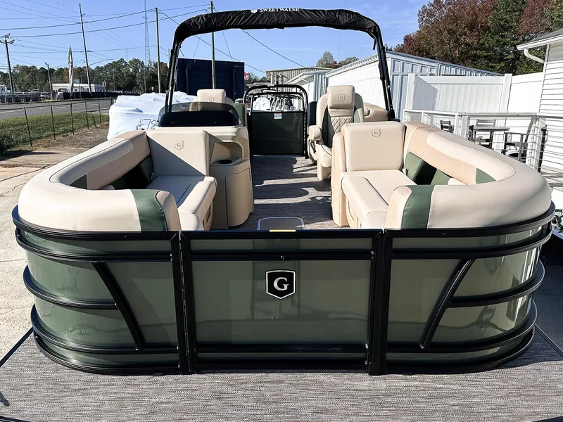 Slide: The Image of 2025 Godfrey Sweetwater Tritoon with split bench seating, showcased outdoors. - 3