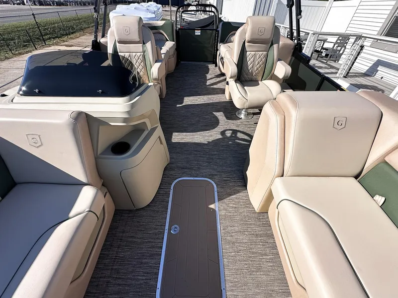 Slide: The Image of Luxurious 2025 Godfrey Sweetwater Tritoon interior with plush seating and modern design. - 9