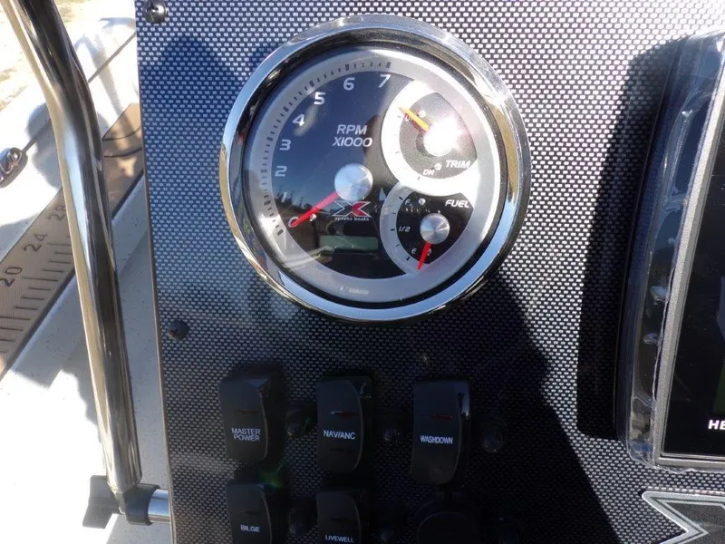 Slide: The Image of Dashboard of 2025 Xpress H24Bay boat with RPM and fuel gauges. - 10
