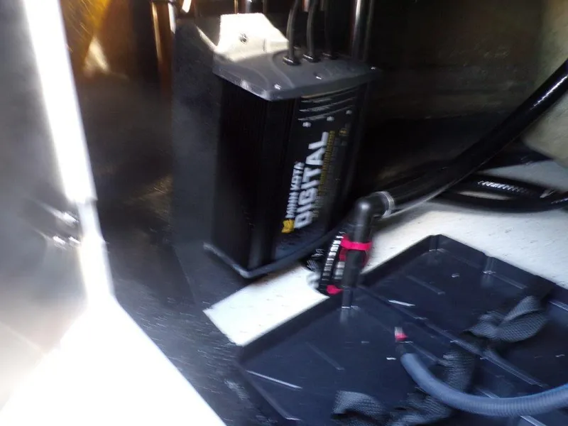Slide: The Image of Battery charger setup in 2025 Xpress H24Bay boat compartment. - 14
