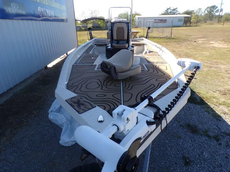 Slide: The Image of 2025 Xpress H24Bay boat with modern seating and advanced trolling motor. - 22