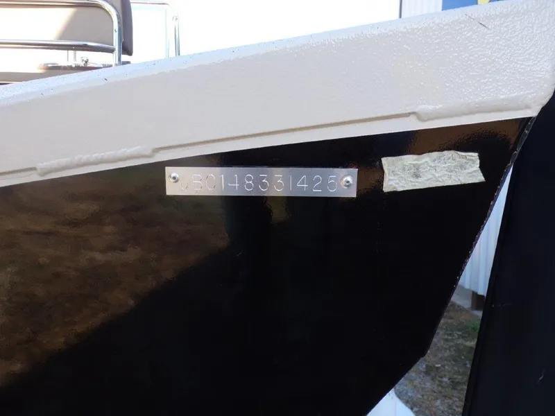 Slide: The Image of 2025 Xpress H24Bay boat hull with identification number plate. - 23
