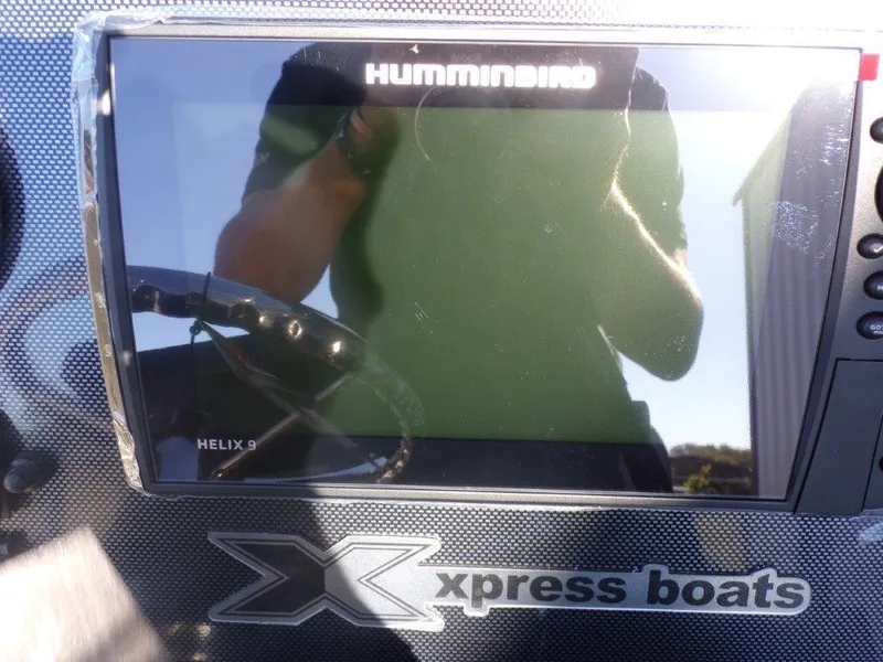 Slide: The Image of Humminbird Helix 9 display on 2025 Xpress H24Bay boat dashboard. - 9