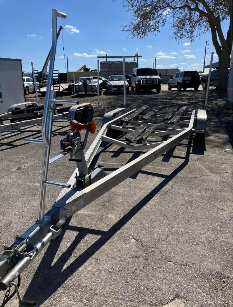 Slide: The Image of Boat trailer for 2015 Sea Born FX24 Bay, parked outdoors. - 10