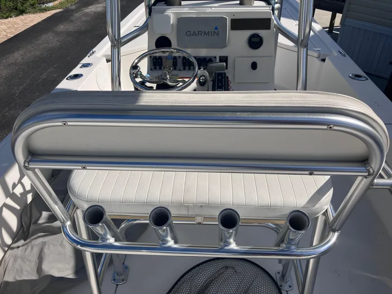Slide: The Image of 2015 Sea Born FX24 Bay boat interior with Garmin system and rod holders. - 15