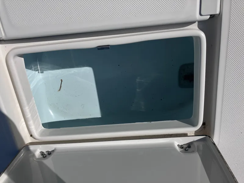 Slide: The Image of Open storage compartment on 2015 Sea Born FX24 Bay boat. - 17