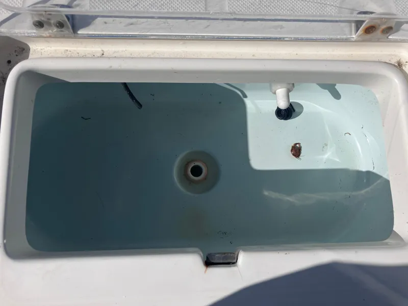 Slide: The Image of Livewell in 2015 Sea Born FX24 Bay boat, partially filled with water. - 19