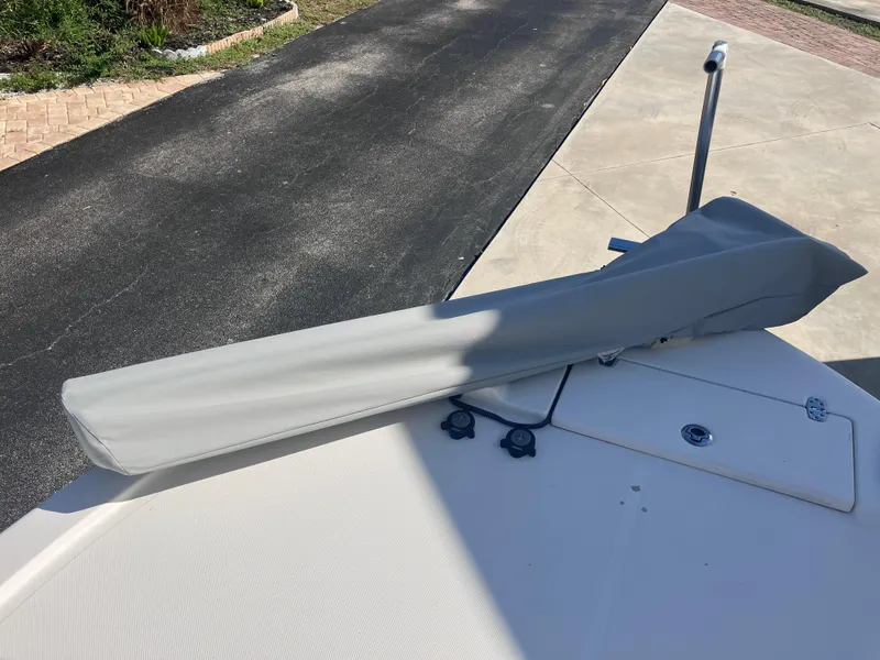 Slide: The Image of 2015 Sea Born FX24 Bay boat with covered equipment on deck. - 28