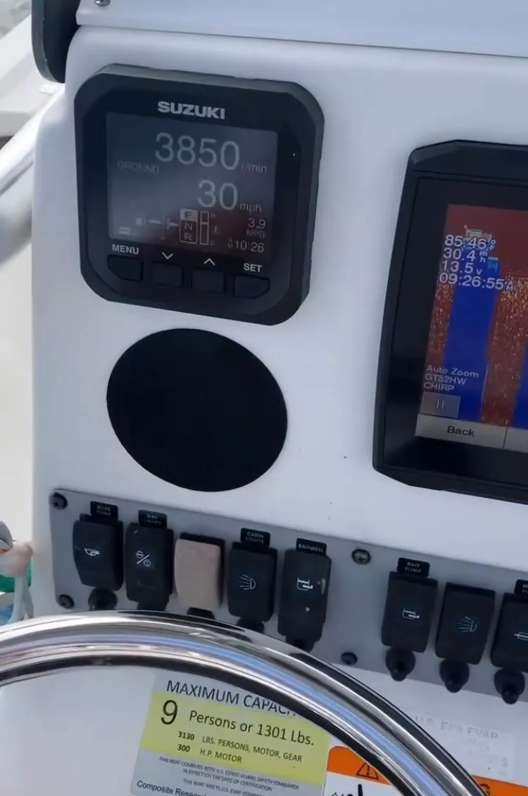 Slide: The Image of 2015 Sea Born FX24 Bay boat dashboard with Suzuki display and controls. - 7