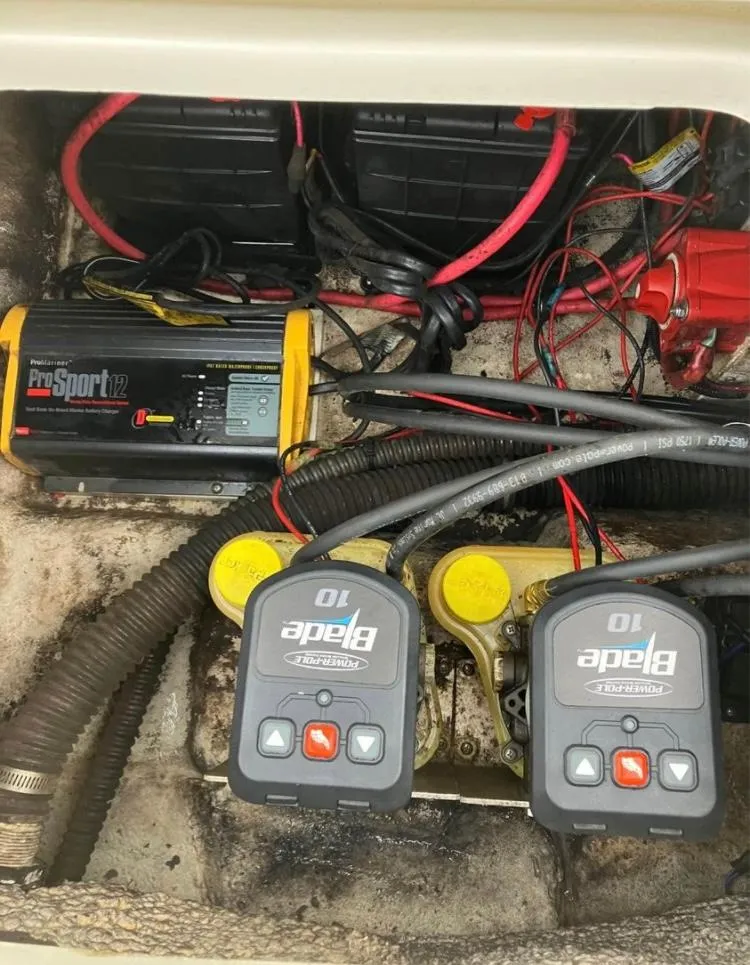 Slide: The Image of 2015 Sea Born FX24 Bay boat battery compartment with wiring and chargers. - 9