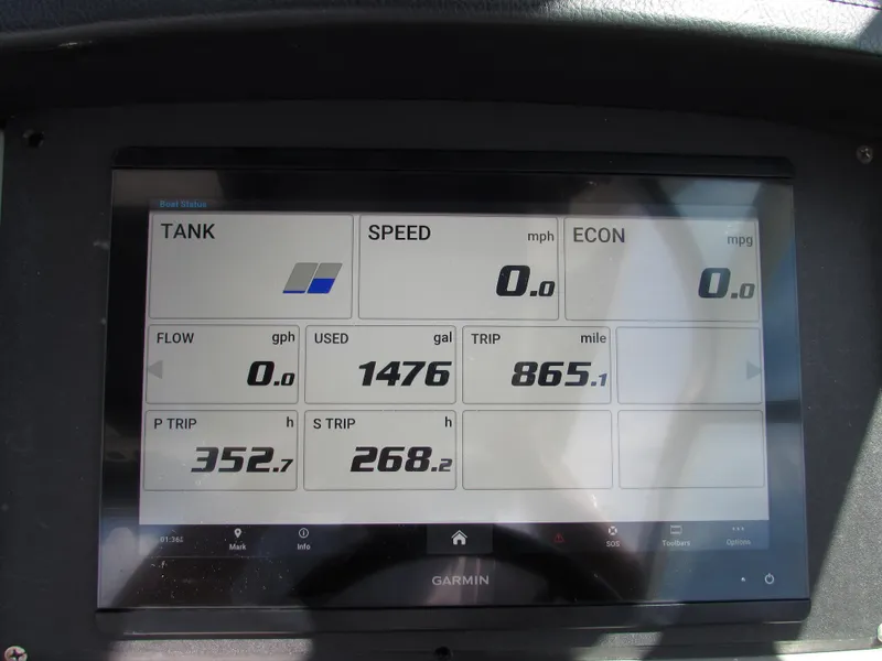 Slide: The Image of Garmin display on 2017 Robalo 317 boat showing fuel and trip data. - 10