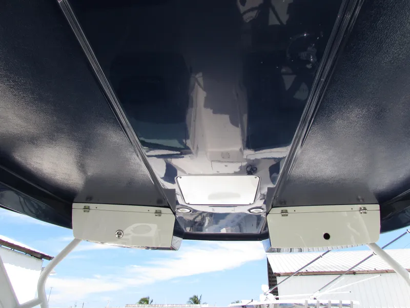 Slide: The Image of 2017 Robalo 317 boat underside view with sleek design and storage compartments. - 12