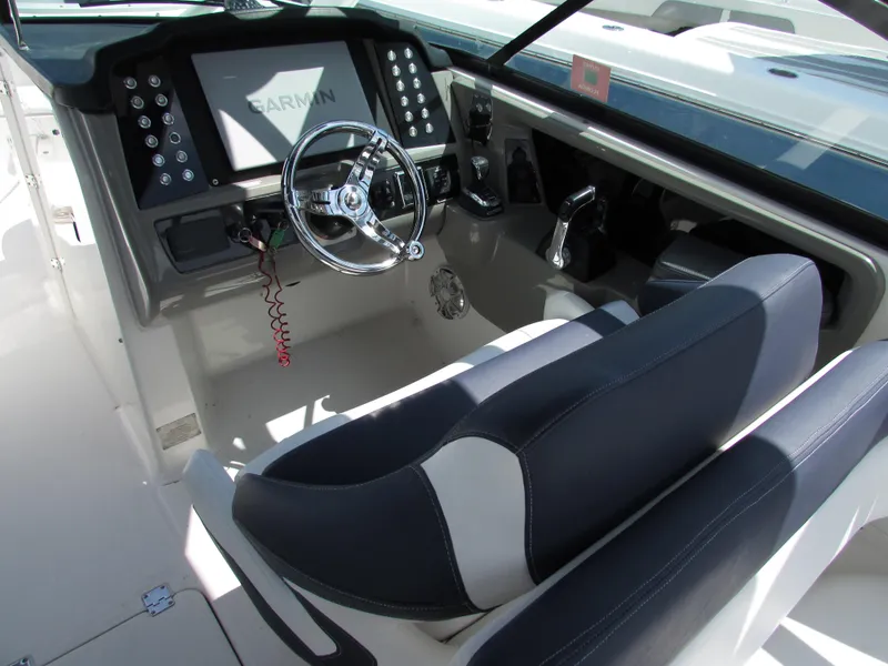 Slide: The Image of 2017 Robalo 317 boat cockpit with Garmin navigation system and dual seating. - 4