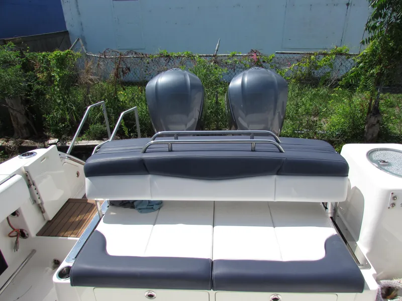 Slide: The Image of 2017 Robalo 317 boat with dual engines and cushioned seating. - 9