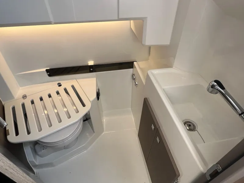 Slide: The Image of 2025 Jeanneau NC 895 Sport S2 boat bathroom with toilet and sink. - 24