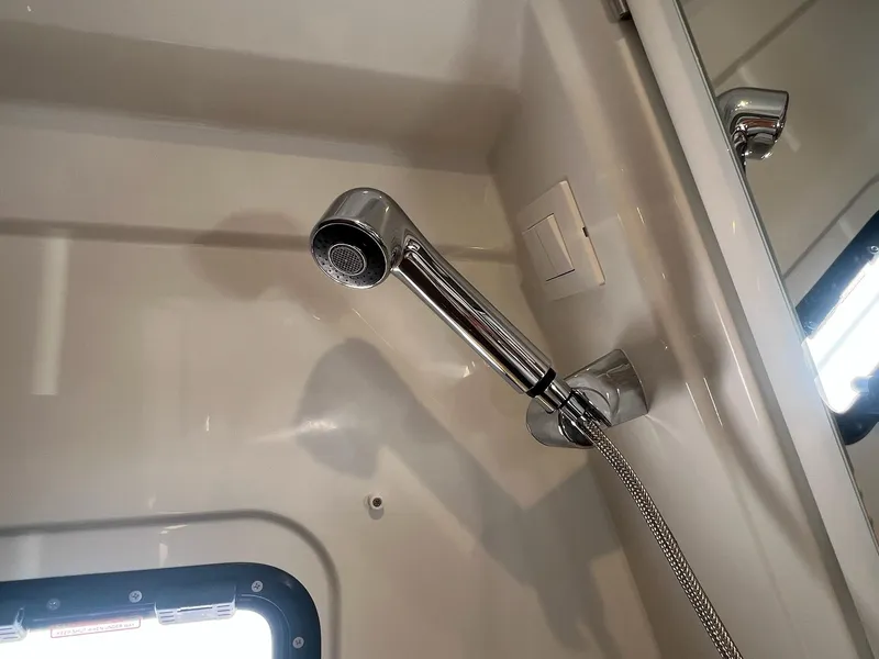 Slide: The Image of Showerhead in Jeanneau NC 895 Sport S2 boat, 2025 model, featuring sleek chrome design. - 25