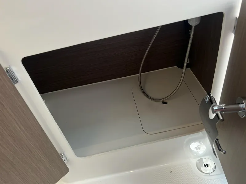Slide: The Image of Storage compartment in 2025 Jeanneau NC 895 Sport S2 boat, featuring sleek interior design. - 31
